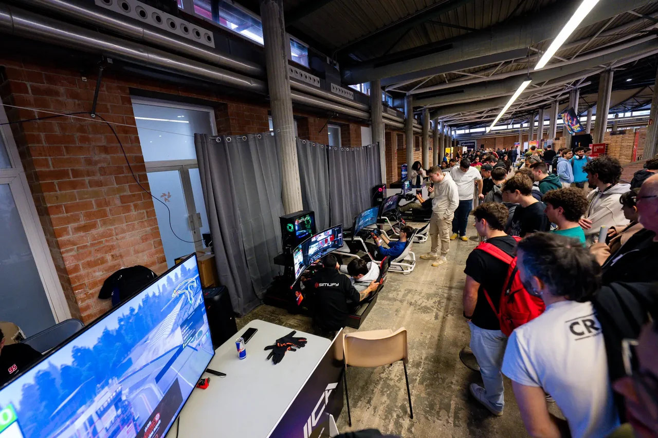 Visitors using racing simulators at the Girotronica and Simufy activation